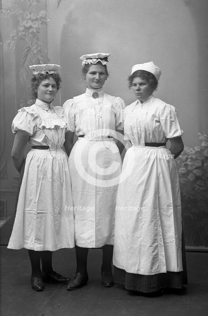 Portrait of three female dairy workers, Landskrona, Sweden, 1910.  Creator: Unknown.