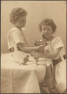 Portrait of Two Sisters Holding Statue and Wreath, 1907-1943. Creator: Louis Fleckenstein
