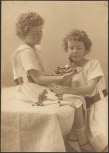 Portrait of Two Sisters Holding Statue and Wreath, 1907-1943. Creator: Louis Fleckenstein