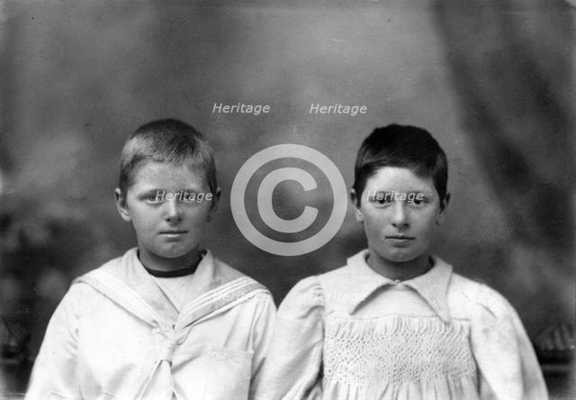 Portrait of two unknown siblings (brother and sister), c1900s. Creator: Robert Augustus Henry L'Estrange.