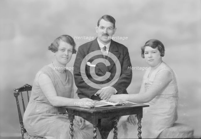 Portrait of two women and a man, c1935. Creator: Kirk & Sons of Cowes.
