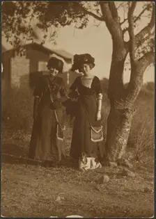 Portrait of Two Women Dressed Up in the Backyard, 1907-1943. Creator: Louis Fleckenstein