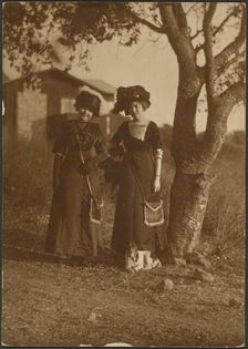 Portrait of Two Women Dressed Up in the Backyard, 1907-1943. Creator: Louis Fleckenstein