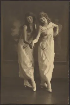 Portrait of Two Young Women in Matching Dresses, 1907-1924. Creator: Louis Fleckenstein