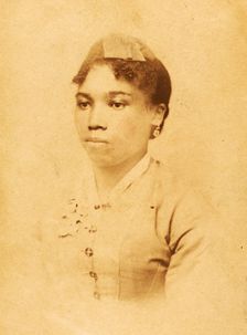 Portrait of unidentified young woman wearing ribbon on head, c1880-c1889. Creator: JW Perkins