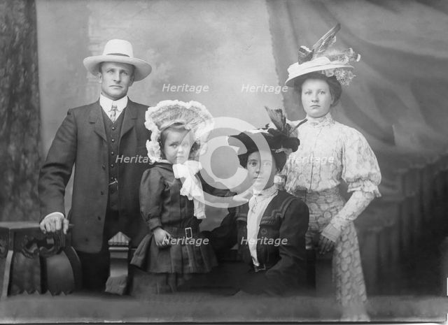 Portrait of unknown family, 1906. Creator: Robert Augustus Henry L'Estrange.