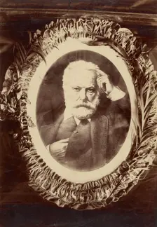 Portrait of Victor Hugo framed by wreath, about 1870-1885. Creator: Unknown