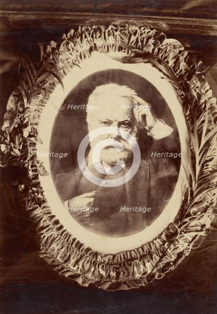 Portrait of Victor Hugo framed by wreath, about 1870-1885. Creator: Unknown.