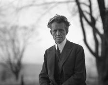 Portrait photograph of Arnold Genthe taken outdoors, between 1911 and 1942. Creator: Arnold Genthe