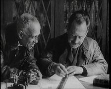 Portuguese Airmen Sacadura Cabral and Gago Coutinho Looking at a Map, 1922. Creator: British Pathe Ltd