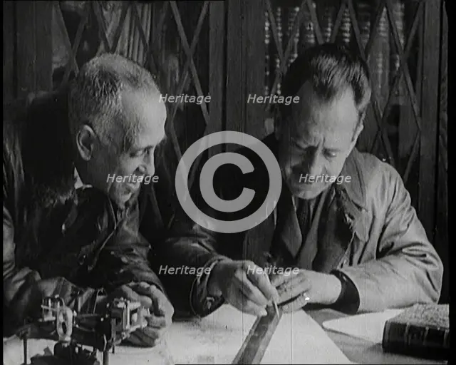 Portuguese Airmen Sacadura Cabral and Gago Coutinho Looking at a Map, 1922. Creator: British Pathe Ltd.