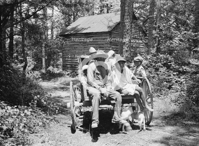 Possibly: Colored sharecropper and his children about to leave..., Shoofly, North Carolina, 1939. Creator: Dorothea Lange.