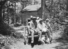 Possibly: Colored sharecropper and his children about to leave..., Shoofly, North Carolina, 1939. Creator: Dorothea Lange