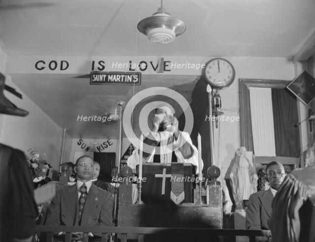 Possibly: Congregation of the St. Martin's Spiritual Church, Washington, D.C., 1942. Creator: Gordon Parks.