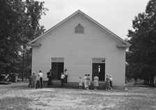 Possibly: Congregation entering church, Wheeley's Church, Person County, North Carolina, 1939. Creator: Dorothea Lange