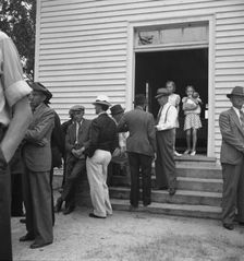 Possibly: Congregation entering church, Wheeley's Church, Person County, North Carolina, 1939. Creator: Dorothea Lange
