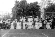 Possibly City Electric Light company employees and their families on a tennis court, 1903. Creator: Robert Augustus Henry L'Estrange