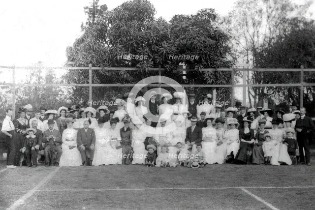 Possibly City Electric Light company employees and their families on a tennis court, 1903. Creator: Robert Augustus Henry L'Estrange.