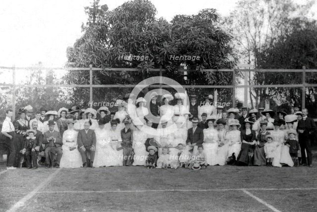 Possibly City Electric Light company employees and their families on a tennis court, 1903. Creator: Robert Augustus Henry L'Estrange.