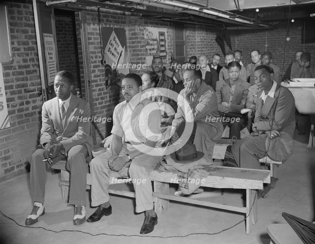 Possibly: Air raid wardens' meeting in zone nine, Southwest area, Washington, D.C., 1942. Creator: Gordon Parks.