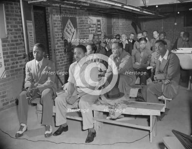 Possibly: Air raid wardens' meeting in zone nine, Southwest area, Washington, D.C., 1942. Creator: Gordon Parks.