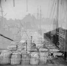 Possibly: Barrels of fish on the docks at the Fulton fish market ready to be..., New York, 1943. Creator: Gordon Parks