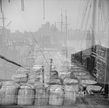 Possibly: Barrels of fish on the docks at the Fulton fish market ready to be..., New York, 1943. Creator: Gordon Parks