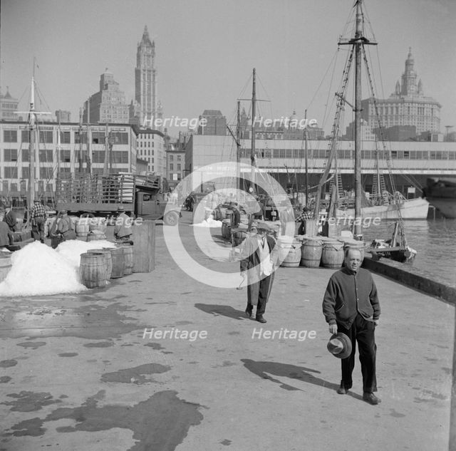 Possibly: Barrels of fish on the docks at Fulton fish market ready to be shipped..., New York, 1943. Creator: Gordon Parks.