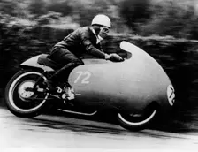 Possibly Bill Lomas, on a Moto Guzzi V8, 1957