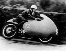Possibly Bill Lomas, on a Moto Guzzi V8, 1957