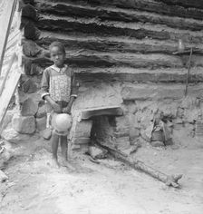 Possibly: Grandchildren of tobacco sharecropper down at barns, Wake County, North Carolina, 1939. Creator: Dorothea Lange