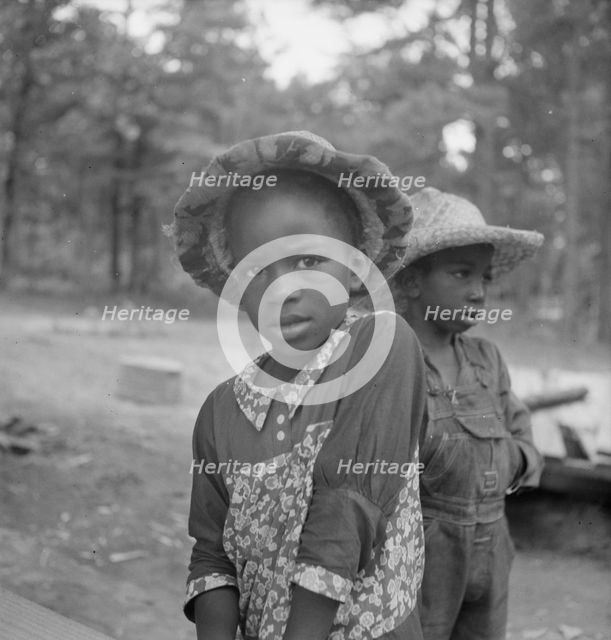 Possibly: Grandchildren of tobacco sharecropper down at barns, Wake County, North Carolina, 1939. Creator: Dorothea Lange.