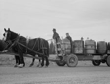 Possibly: Farmer and his boy hauling water for drinking and domest..., Boundary County, Idaho, 1939. Creator: Dorothea Lange