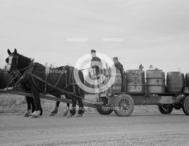 Possibly: Farmer and his boy hauling water for drinking and domest..., Boundary County, Idaho, 1939. Creator: Dorothea Lange.