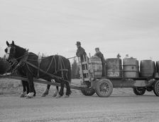 Possibly: Farmer and his boy hauling water for drinking and domest..., Boundary County, Idaho, 1939. Creator: Dorothea Lange
