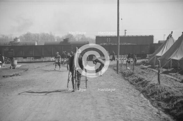 Possibly: Flood refugee encampment at Forrest City, Arkansas, ca. 1937. Creator: Walker Evans.