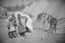 Possibly: Flood refugee encampment at Forrest City, Arkansas, ca. 1937. Creator: Walker Evans