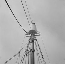Possibly: Frank Mineo, owner of the Alden, climbs to the crow's..., Gloucester, Massachusetts], 1943 Creator: Gordon Parks