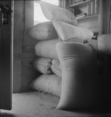 Possibly: Interior of farmer's two-room log home, FSA borrower, Boundary County, Idaho, 1939. Creator: Dorothea Lange