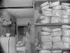 Possibly: Johnnie Lew's Chinese laundry on Monday morning, Washington, D.C., 1942. Creator: Gordon Parks