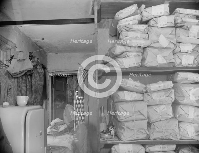Possibly: Johnnie Lew's Chinese laundry on Monday morning, Washington, D.C., 1942. Creator: Gordon Parks.