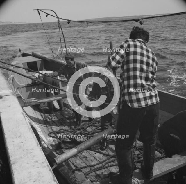 Possibly: On board the fleshing boat Alden, out of Gloucester, Massachusetts, 1943. Creator: Gordon Parks.