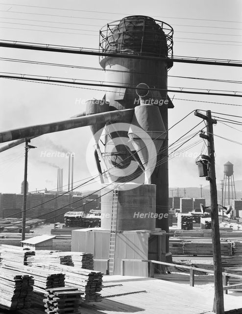 Possibly: Lumber burner and stacks of the Big Lakes Lumber Company..., Klamath Falls, Oregon, 1939. Creator: Dorothea Lange.