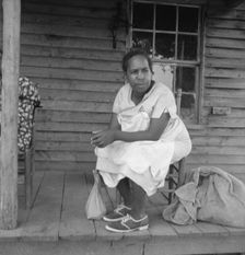 Possibly: Mother of sharecropper family and friend...the rain, Person County, North Carolina, 1939. Creator: Dorothea Lange