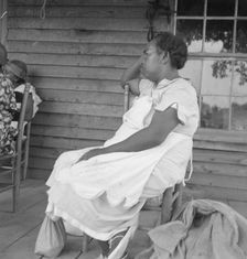 Possibly: Mother of sharecropper family and friend...the rain, Person County, North Carolina, 1939. Creator: Dorothea Lange