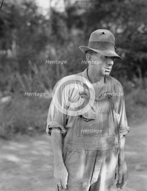 Possibly: Migratory worker in auto camp, Yakima Valley, Washington, 1939. Creator: Dorothea Lange.