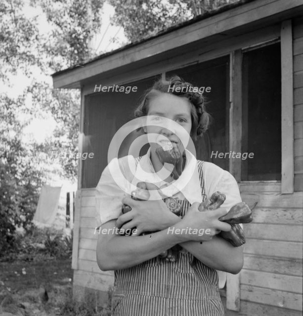 Possibly: Mrs. Schrock takes good care of her family, Yakima Valley, Washington (near Wapato), 1939. Creator: Dorothea Lange.