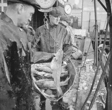 Possibly: New England fishermen unloading fish at the Fulton fish market, New York, 1943. Creator: Gordon Parks