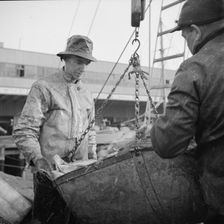 Possibly: New England fishermen unloading fish at the Fulton fish market, New York, 1943. Creator: Gordon Parks