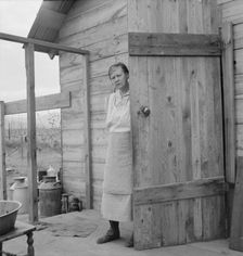 Possibly: New settler shows fish he caught..., Priest River Valley, Bonner County, Idaho, 1939. Creator: Dorothea Lange